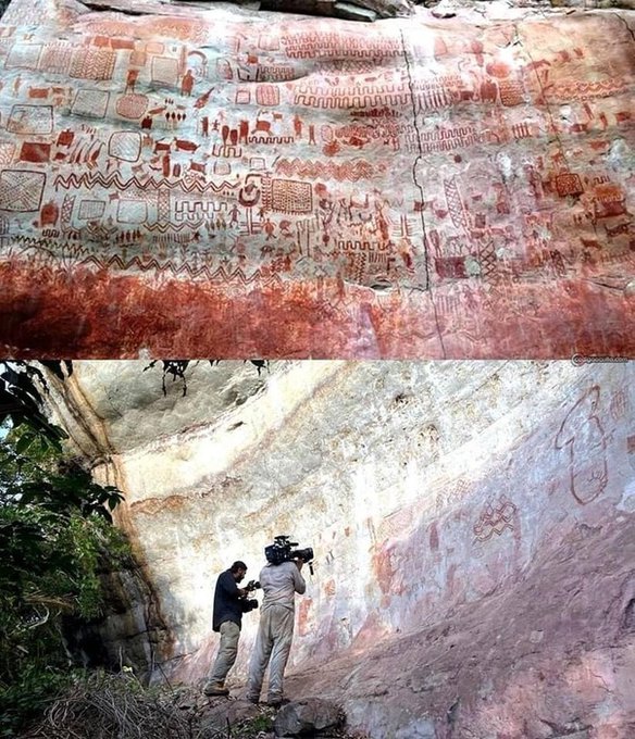 This prehistoric rock art wall is in Brazil and it's about 12,000 years old. The Serra da Capivara National Park is home to one of the most impressive collections of prehistoric rock art in the world. This UNESCO World Heritage site boasts an astonishing array of over 30,000