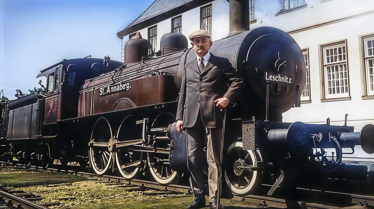 Beneath the silent gaze of the sun-washed sky, where the ancient rails stretch forth like the life-lines of #Leschnitz itself, there stood Emil Wranik—its unyielding #Silesia Groß Strehlitz Kreisabgeordnete.