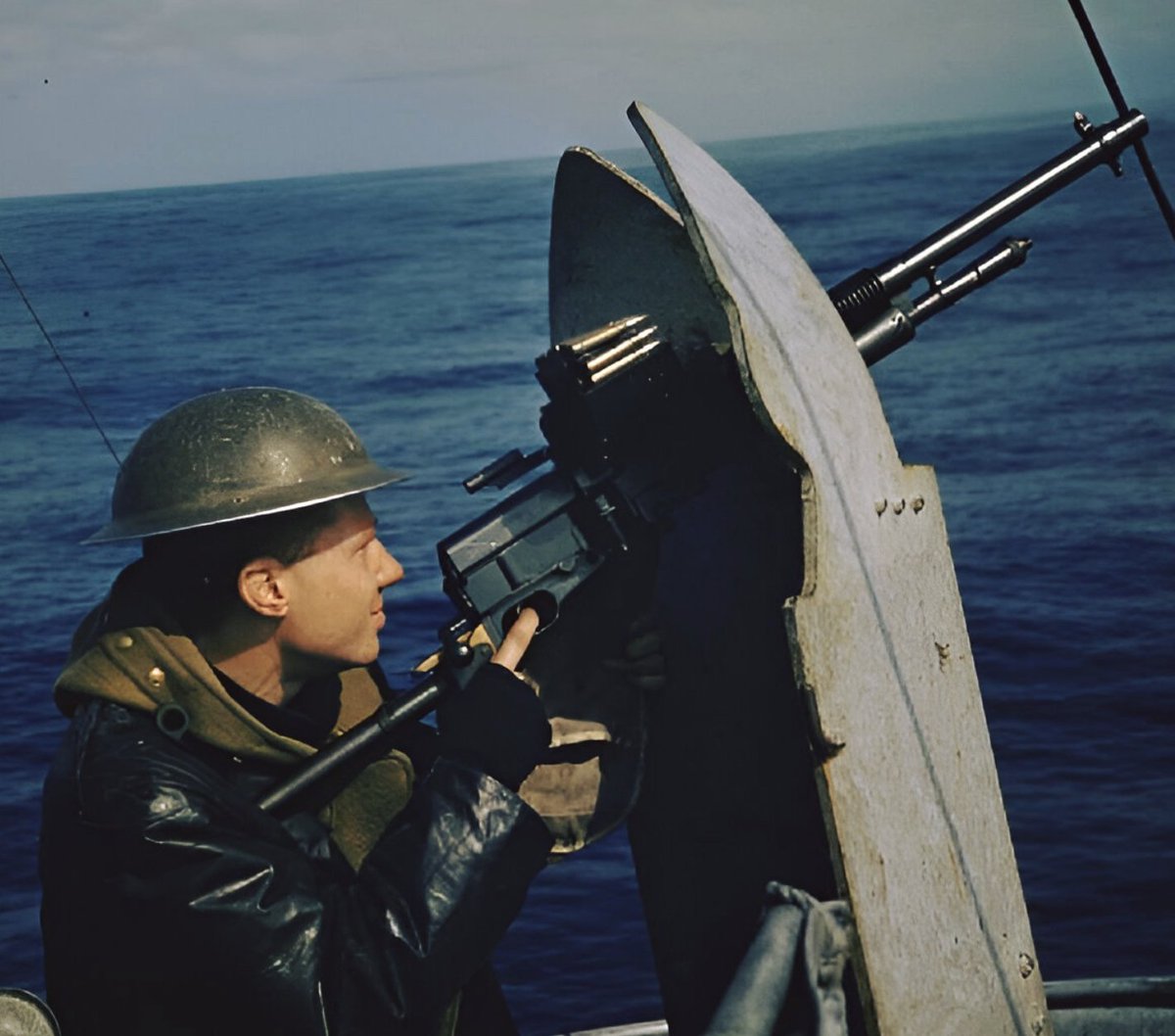 A machine gunner on an escort vessel keeps constant watch as the Royal Navy guards a British convoy across the Atlantic. The weapon is a Hotchkiss M1909 Benét-Mercié machine gun.⚓ S️ource: SSAFA, the Armed Forces charity