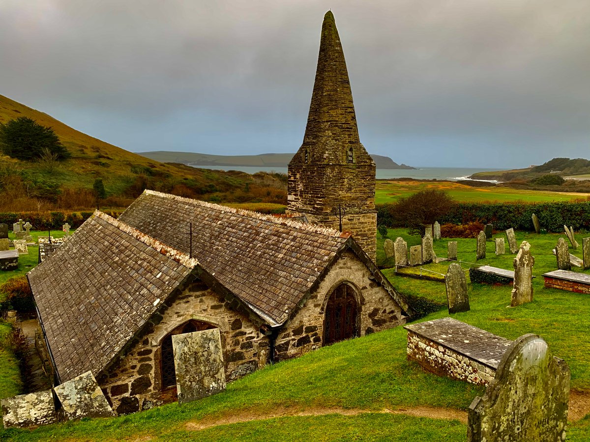 Poking out of the sand dunes that once covered the nave and aisles.
‘Her spire bent like a crooked witch’s hat,
A grave, a stile, a dandelion clock
Then the cool silence of St. Enodoc’
From ‘John Betjeman at Trebetherick’ by John Whitworth #steeplesaturday #churchgoing