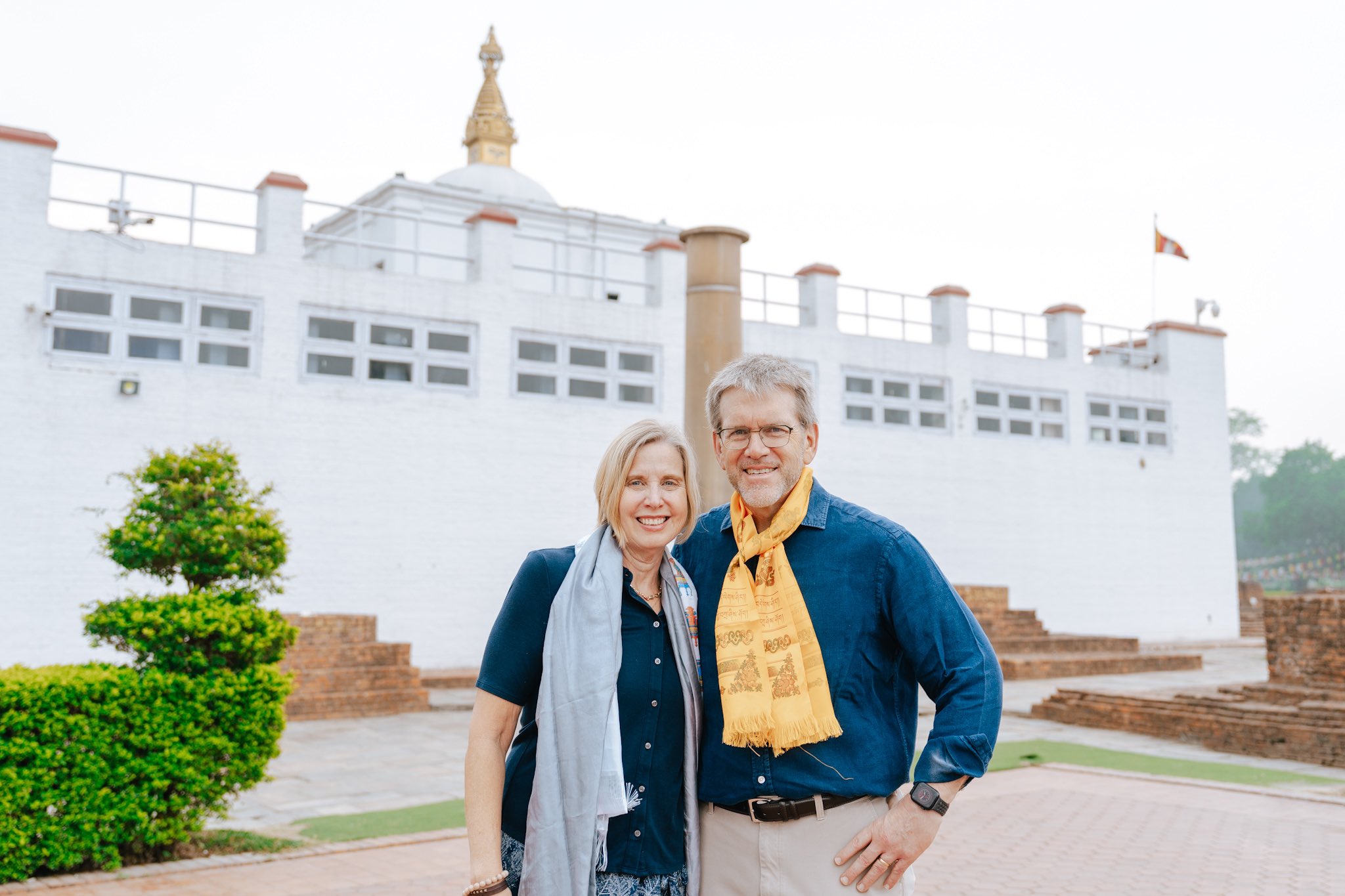 Ambassador Thompson and Jane Thompson posing for picture in front of Maya Devi Temple, Lumbini.