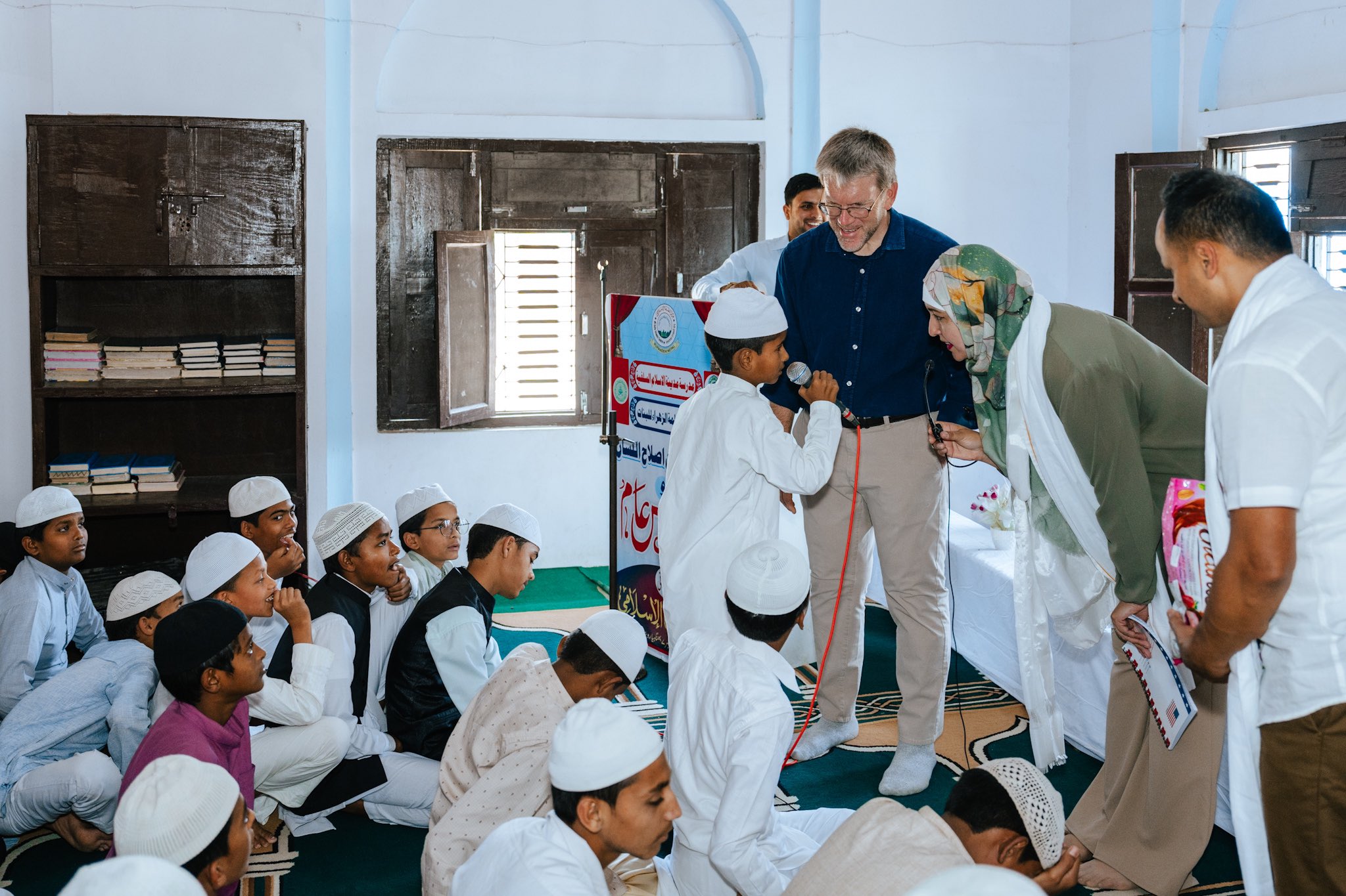 Ambassador Thompson and Embassy’s Spokesperson talking with muslim kids in Madarasa.