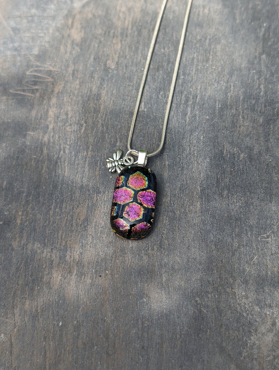 Stunning purple and gold sparkling dichroic glass pendant, amazing necklace and sweet bee charm. #ukgiftam #ukgifthour #handmade #giftideas #shopindie #etsy #etsyuk buff.ly/4aijTcK