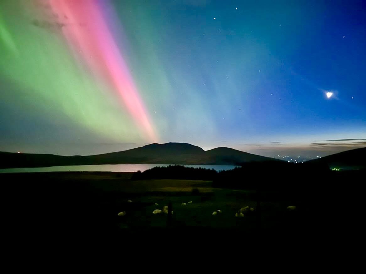 NationalTrustNI's tweet photo. Check out this stunning view over The Mourne Mountains last night! 🌌 Did you catch a glimpse of the Aurora Borealis? Share your favorite shots below! ✨

Image by: @charolette_knox  #NorthernLights #MourneMountains #nationaltrustNI #nationaltrust https://t.co/DkI3OW7hK1