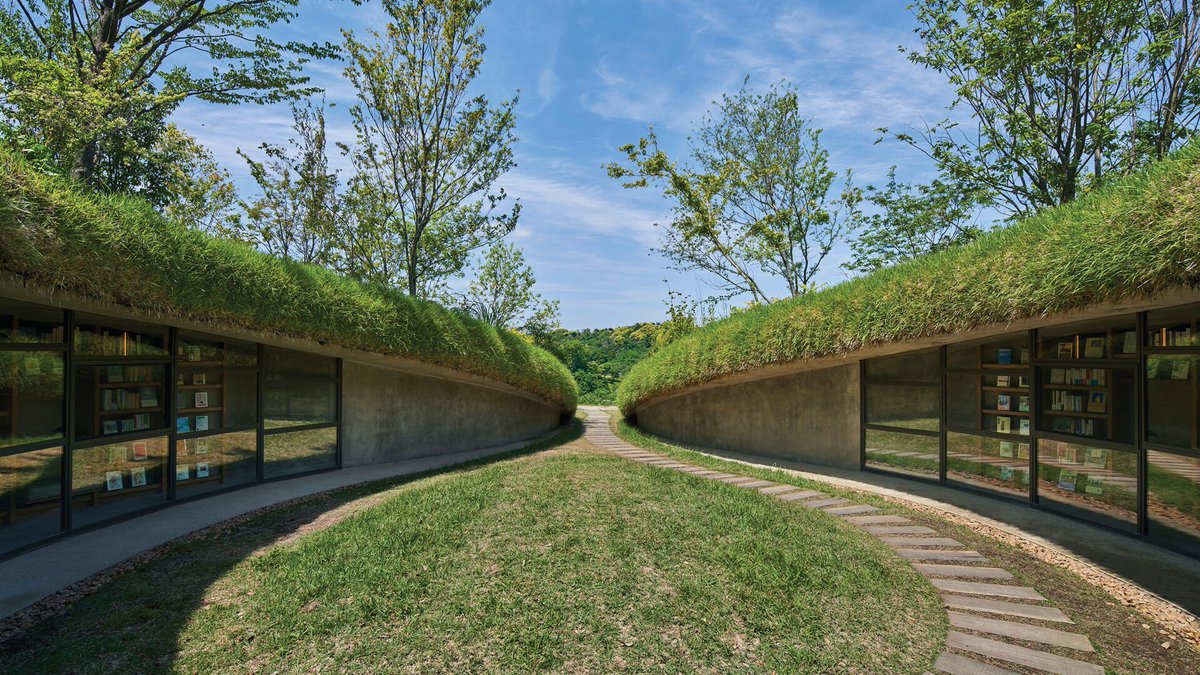 The subterranean library a spectacular reading space located beneath a grassy knoll on the Kurkku Fields sustainable farm in Chiba, Japan, designed by Tokyo-based architecture studio Hiroshi Nakamura and NAP