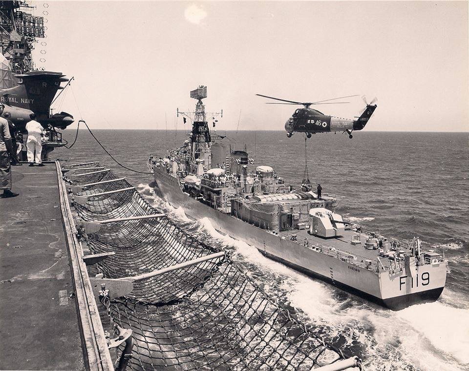 Tribal Class Frigate HMS Eskimo replenishing from Ark Royal. Plane Guard Wessex Vertrep. Vertical Replenishment. Fuel line visible too.
