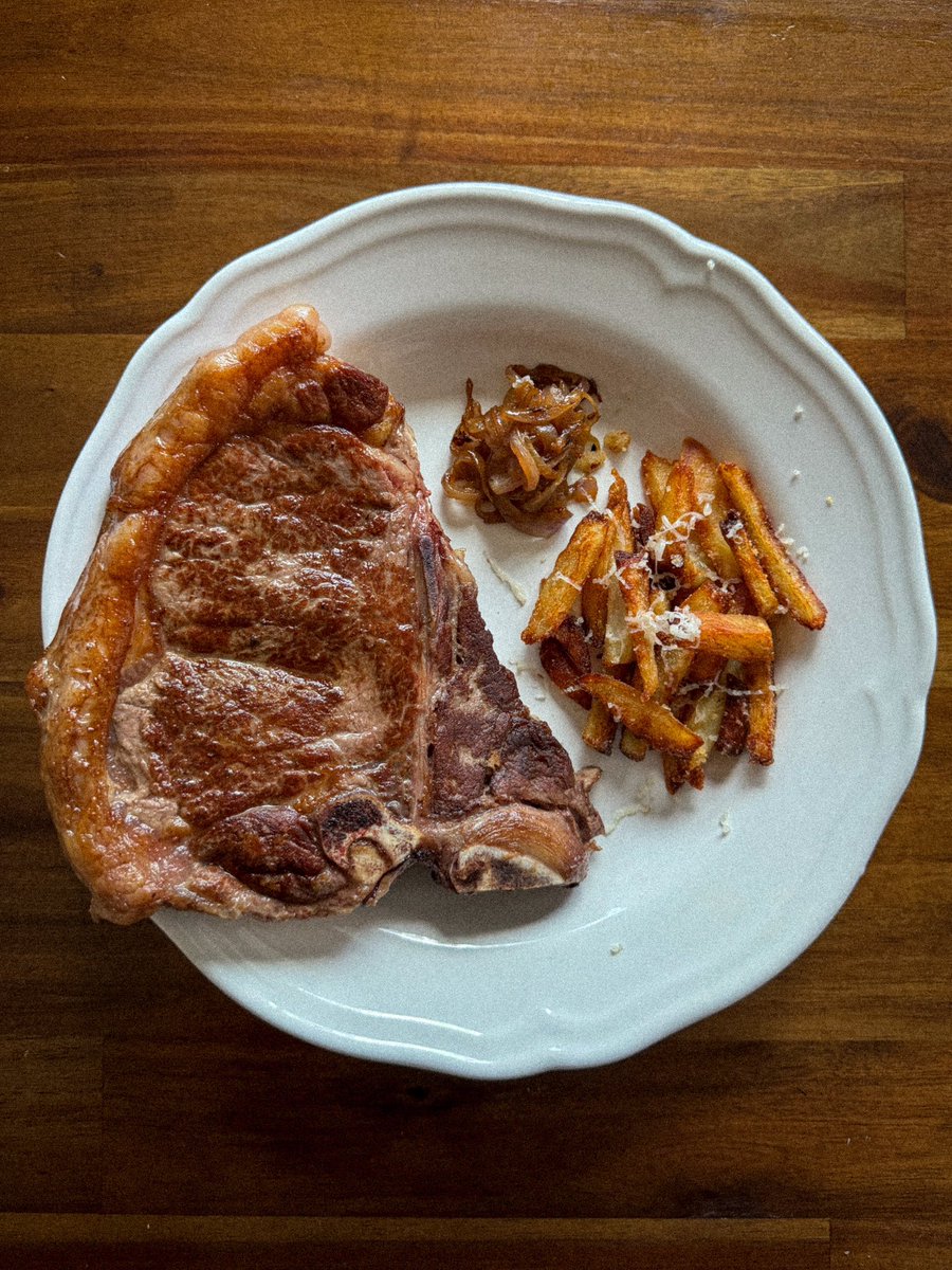 T-bone. Duck fat fries, tossed in garlic powder & sea salt. Raw raclette with truffle shredded on top. A side of the most caramelized onions.
