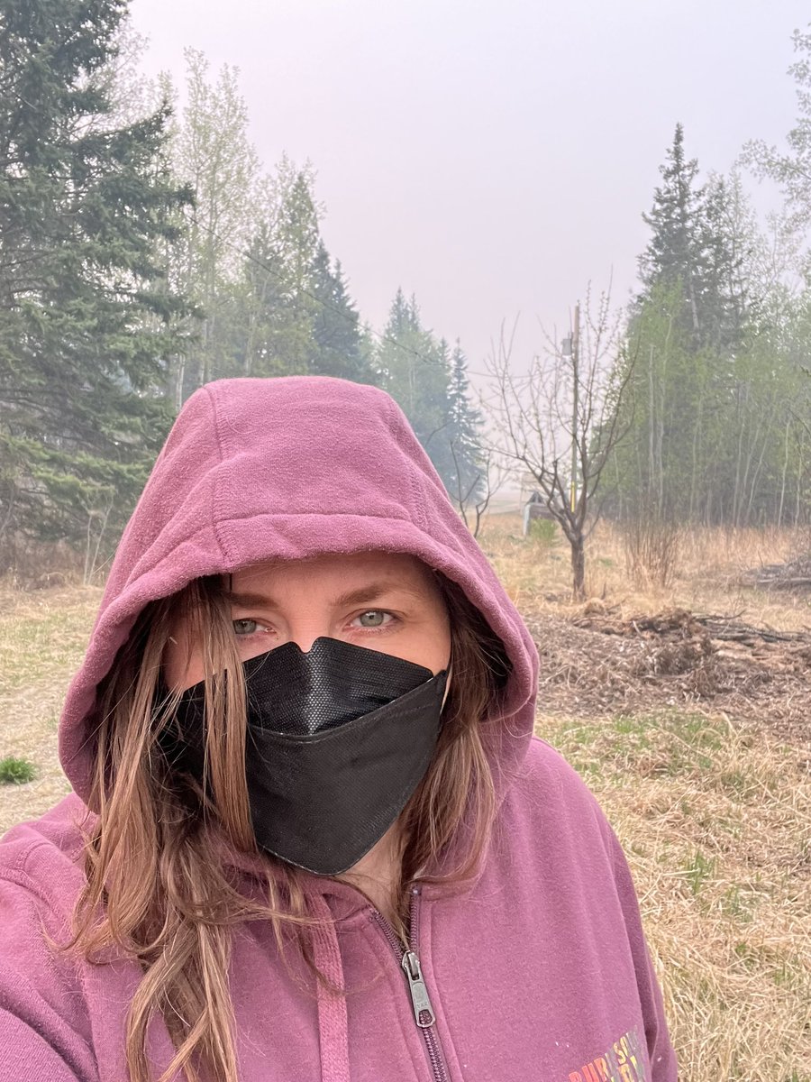 It's 'do my morning chores in an N95' season again. The smoke rolled in here last night. Got the air purifier running on turbo inside. Thinking of everyone facing evacuation this morning across northern Alberta. #wildfires #albertawildfire