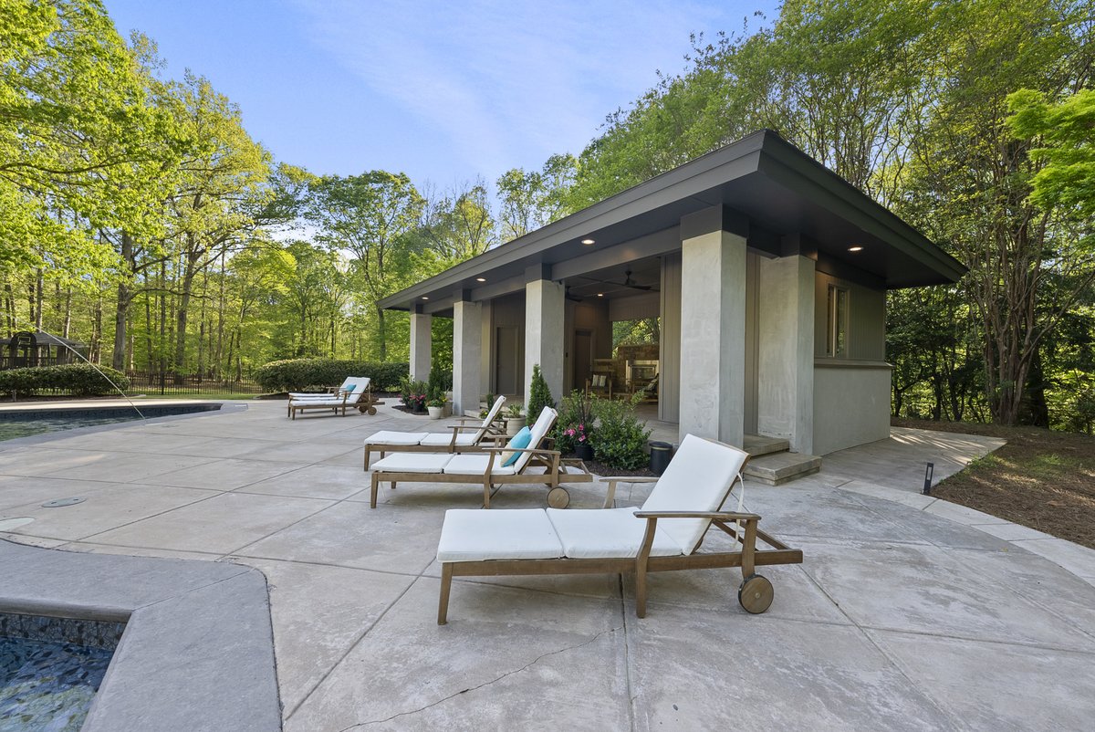 This pool house had it all, outdoor fireplace, full kitchen and full bathroom! #luxury #flyboync #nclistings #raleighrealestate #raleighrealtors #pool #outdoorliving #southerncharm #milliondollarlisting