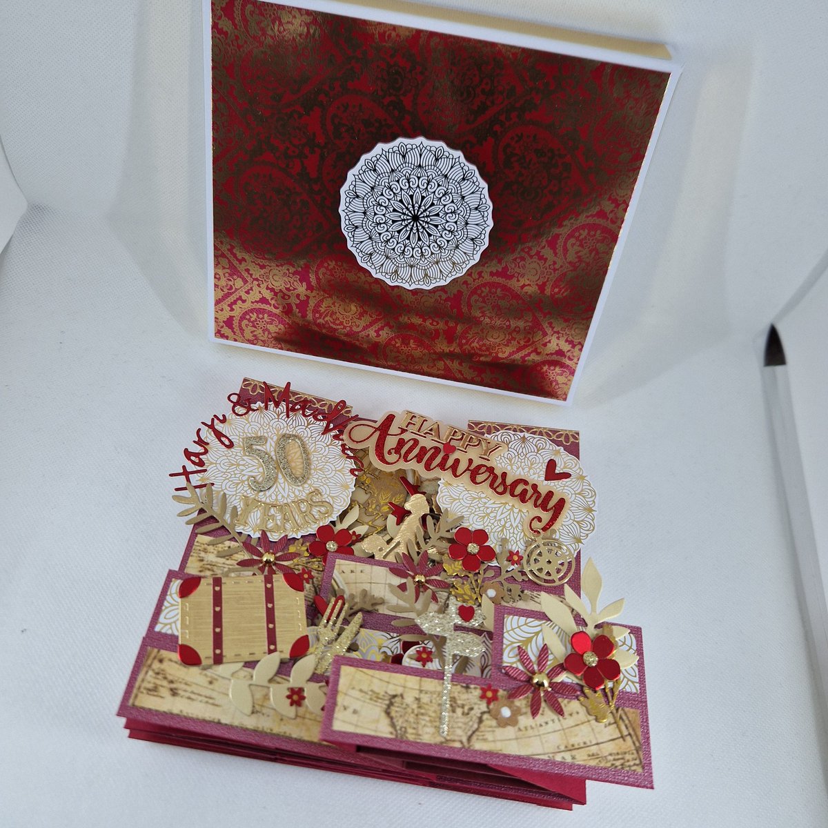 Personalised Indian wedding style 50th Anniversary card. Double display staggered Z-fold pop-up box card.

#handmadecards #handmade #personalised #popupcard #boxcard #50thweddinganniversary #indianwedding #travel #flowers #food #love #couple