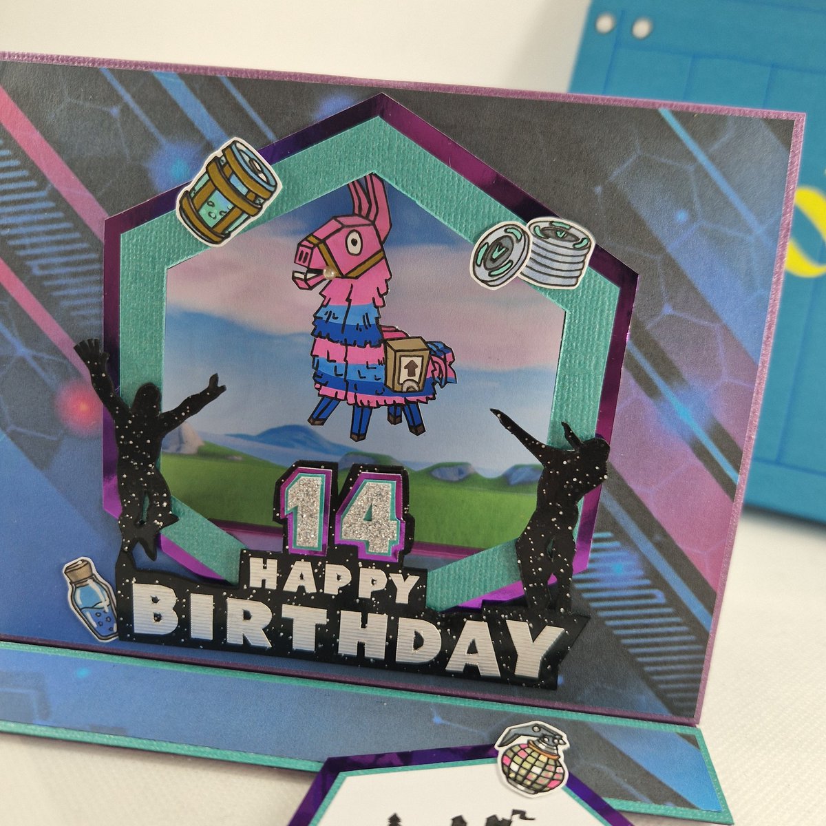 Interactive Fortnite 14th Birthday card. With a coordinating box.

#fortnite #handmade #handmadecards #14thbirthday #swingingtentfoldcard  #popupcard #personalised #papercraft #interactivecard