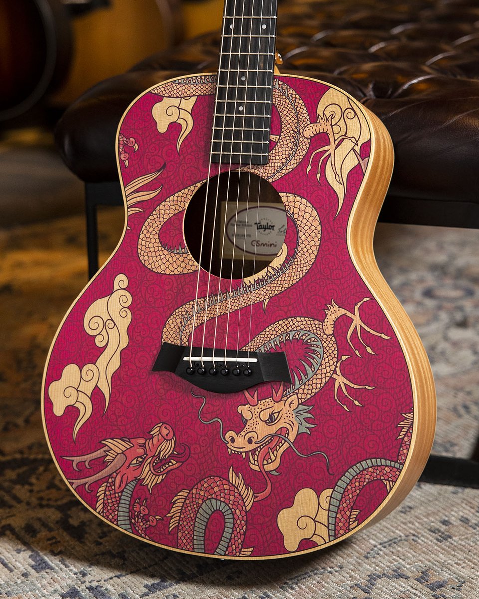 Mythical feature. @TaylorGuitars' 'Year of the Dragon' GS Mini-e puts a special edition spin on their travel-ready model, adding colorful custom art to its solid torrefied spruce top! Check it out: ow.ly/8IS250RCini