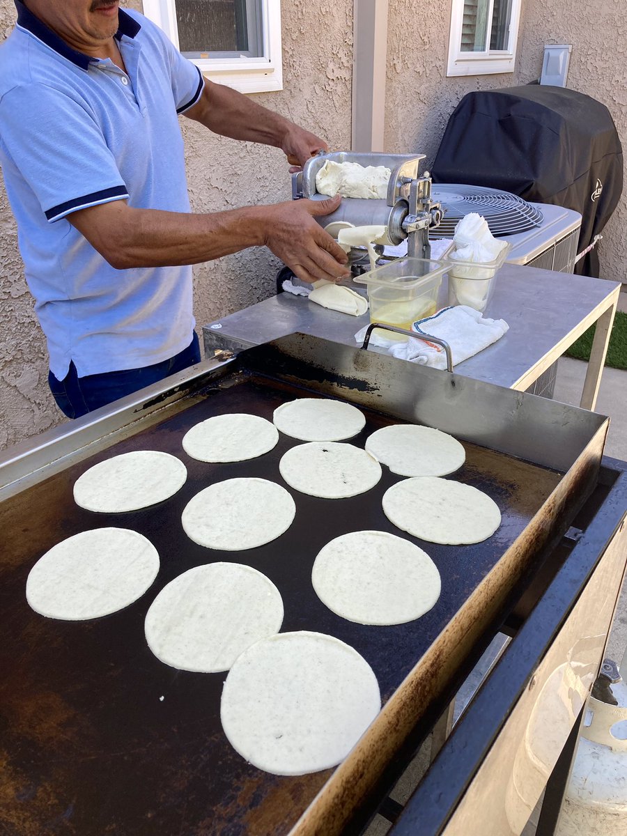 At my niece’s USC graduation party, and my brother sprung for the OG taco man making tortillas by hand! #HomoWork