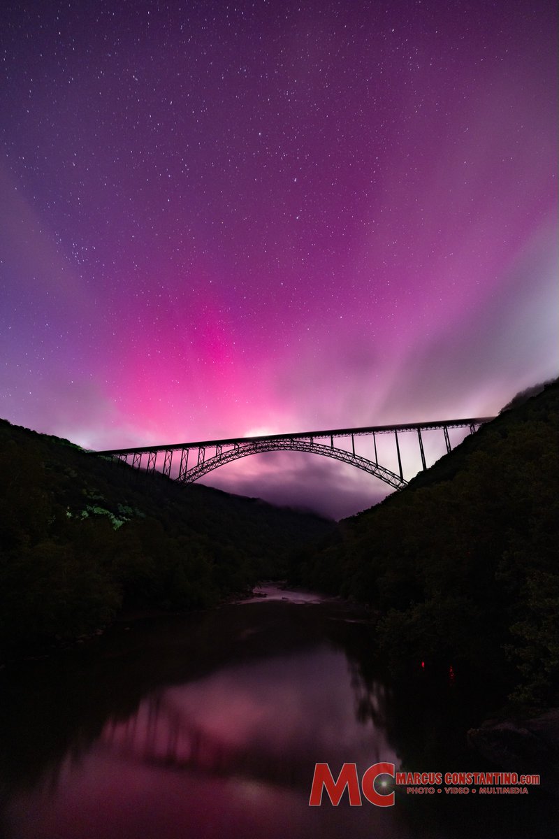 The Northern Lights dance over the New River Gorge Bridge in West Virginia, Saturday, May 11, 2024. Buy this print: photos.marcusconstantino.com/p641049411 #northernlights #aurora #WestVirginia #AlmostHeaven