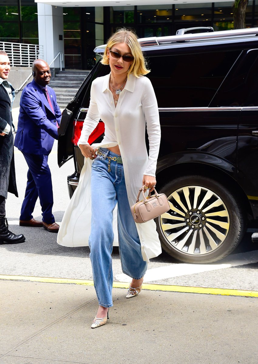 Gigi Hadid stepped out wearing jewel-encrusted stilettos (not slippers or tasseled loafers), which will emit a Carrie Bradshaw-shaped halo around even the most casual dressers. See all the details on her look: vogue.cm/kQ42TaI