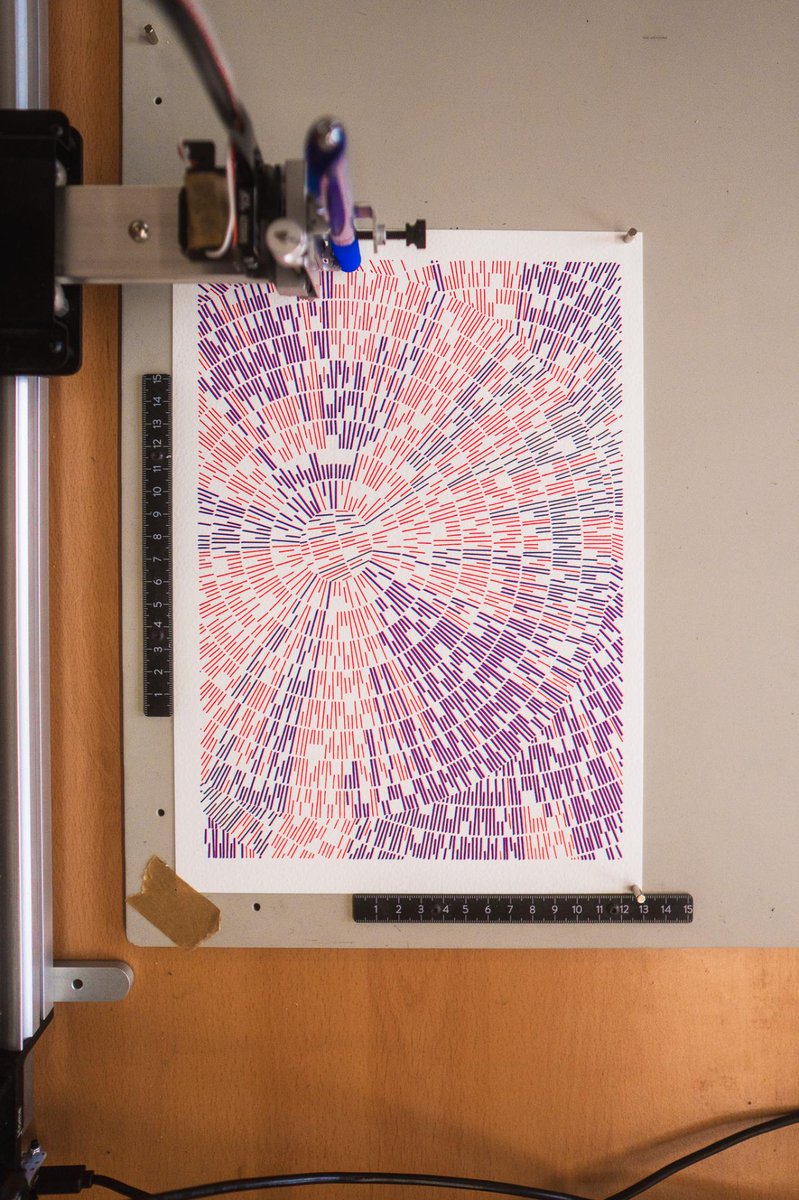 🤖 A new perspective on our pen plotter journey—this zoomed-out shot reveals the intricate dance between colors, guided by path optimization. #ArtisticExploration /via Normal Kitty 😺