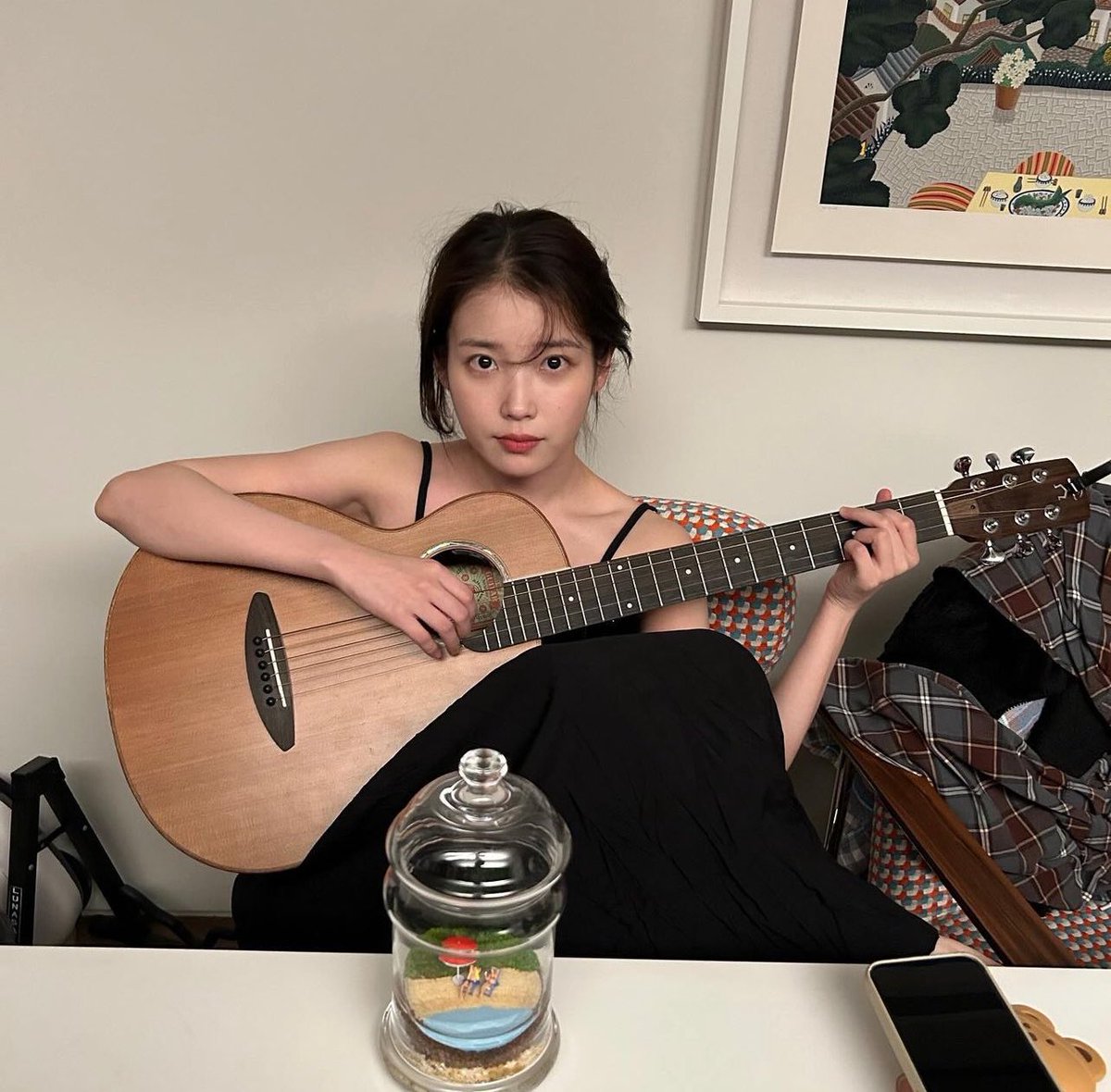 no bcs IU holding a guitar????? This saved our lives tbh