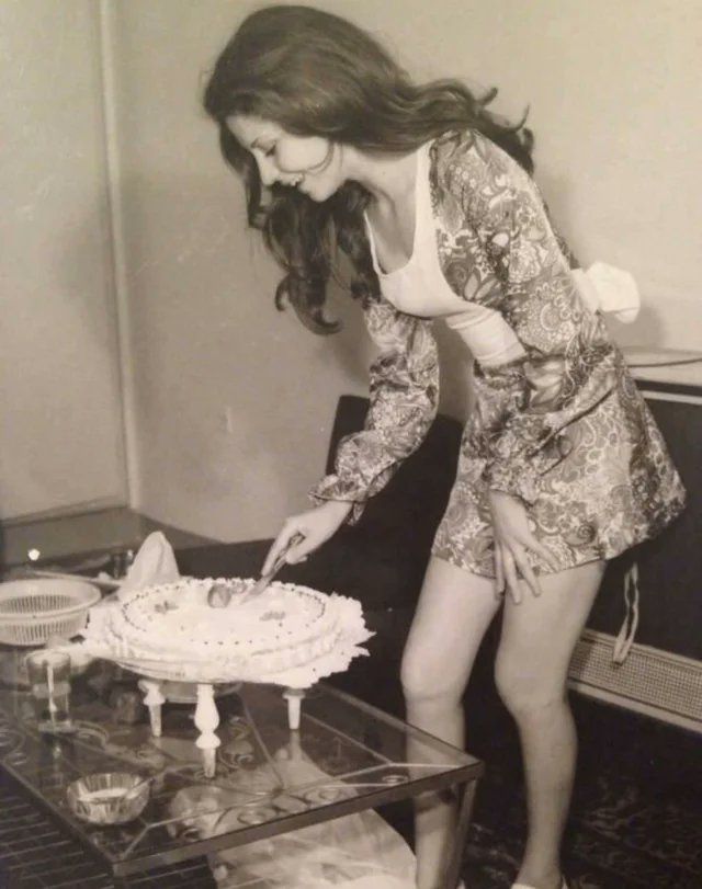 A woman cuts her birthday cake in Iran, 1973
