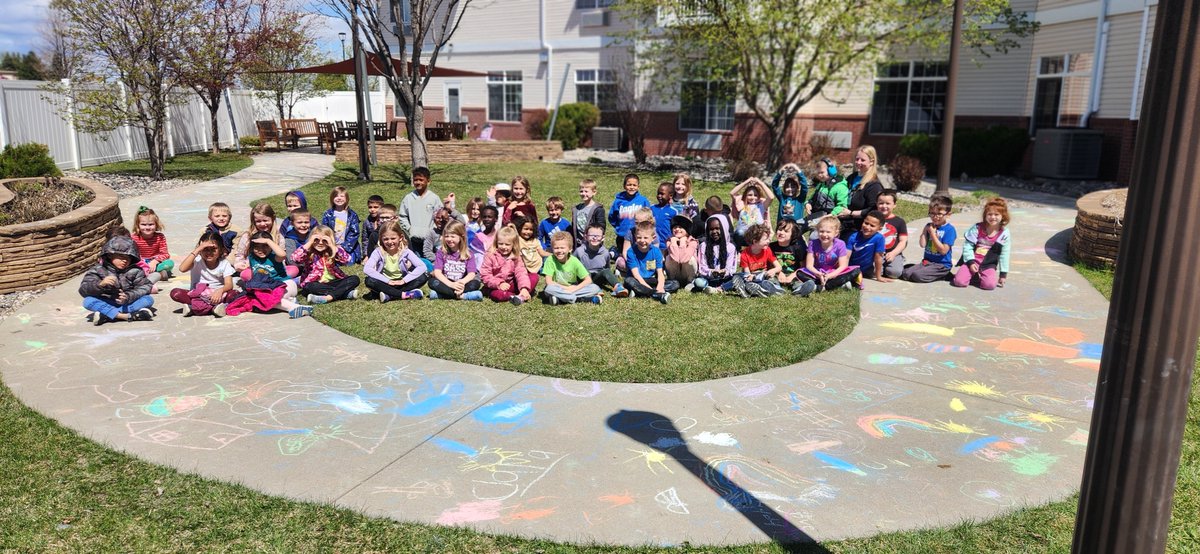 Eagles Elementary School kindergarteners brought some color to the sidewalks at Touchmark at Harwood Groves. The students worked together to create works of art out of sidewalk chalk for the residents to enjoy.