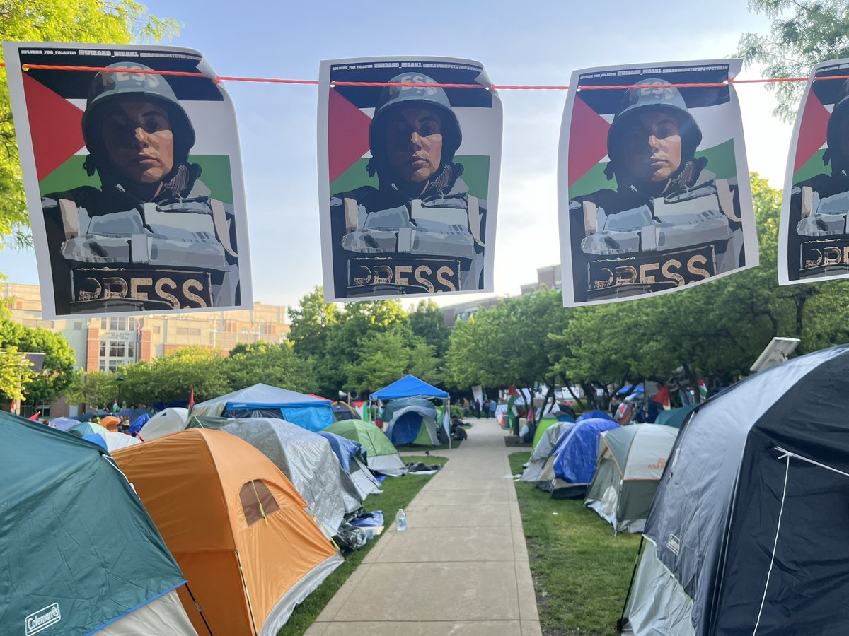 Good afternoon from beautiful day 12 at DePaul’s Gaza Liberation Zone, the longest lasting solidarity camp in Chicago and now one of the longest lasting in the world. Lots of beautiful art I’d like to share with you, starting w this gorgeous banner of @wizardbisan saying PRESS