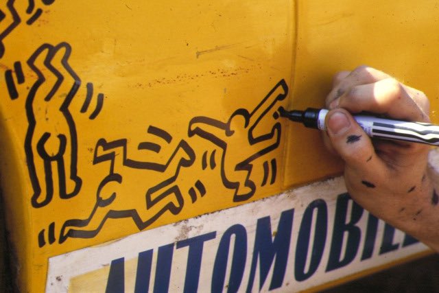 Keith Haring drawing on a 1962 SCAF/Mortarini Mini Ferrari 330 P-2 during the 24 Hours of Le Mans, 1984.