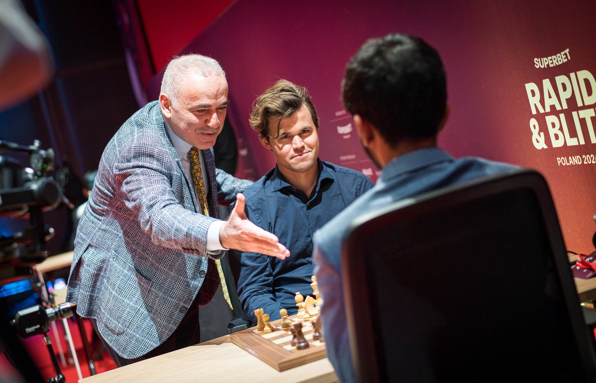 A perfect picture showcasing the past, present and future of chess!

The 13th World Champion Garry Kasparov made the first move of the game between Magnus Carlsen and D. Gukesh.

Photo: Lennart Ootes/ Grand Chess Tour