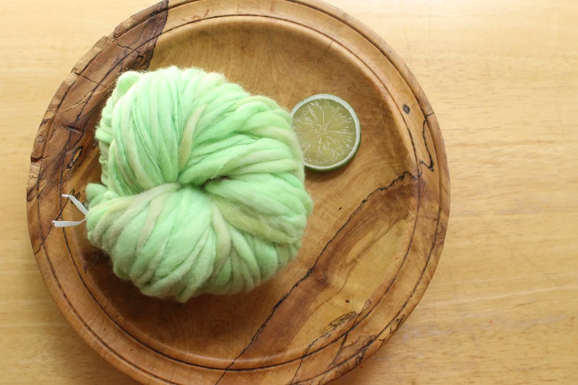 This is extra soft, #merinowool in #handdyed, light, fluffy, sherbet lime.  I've #handspun it in my Petite Thick and Thin style - it has a darling texture when it's #knitted, #crocheted, or #woven. 
etsy.me/3wHrfIW