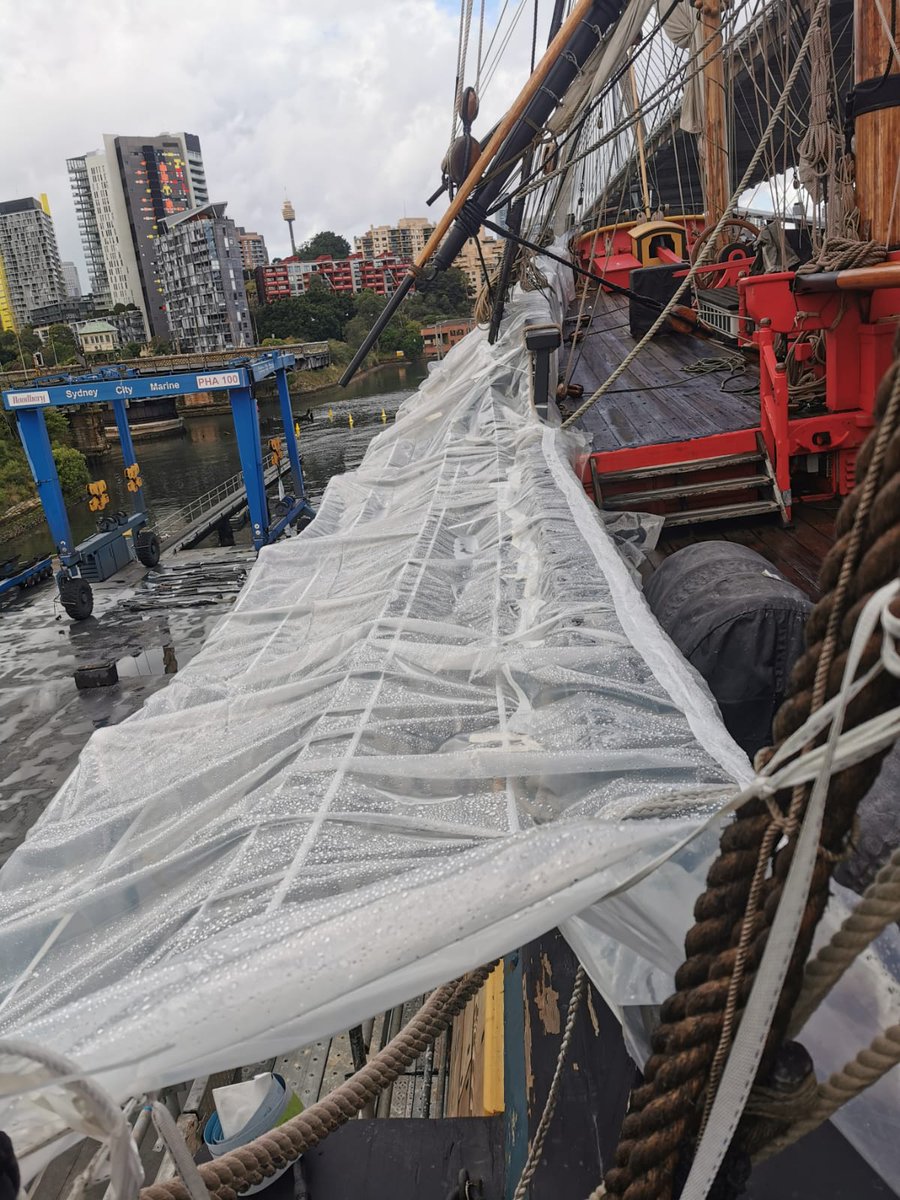 HMB Endeavour replica update⚓ For all of you following along, the Endeavour replica has been in dry dock having routine maintenance completed. Despite the rain the fleet team have made tents on the starboard side so they can keep sanding the topsides of the vessel.