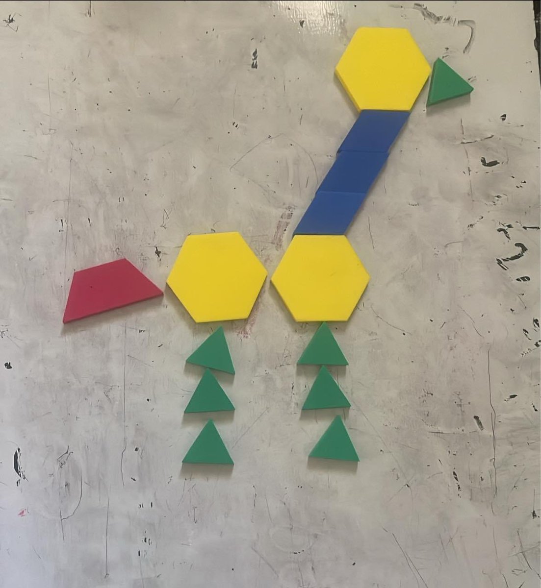Me and the god-son have been making tangrams and exploring fractions. We made an ostrich. If the yellow hexagon has a value of one 1, what is the value of the ostrich? #MathTalk