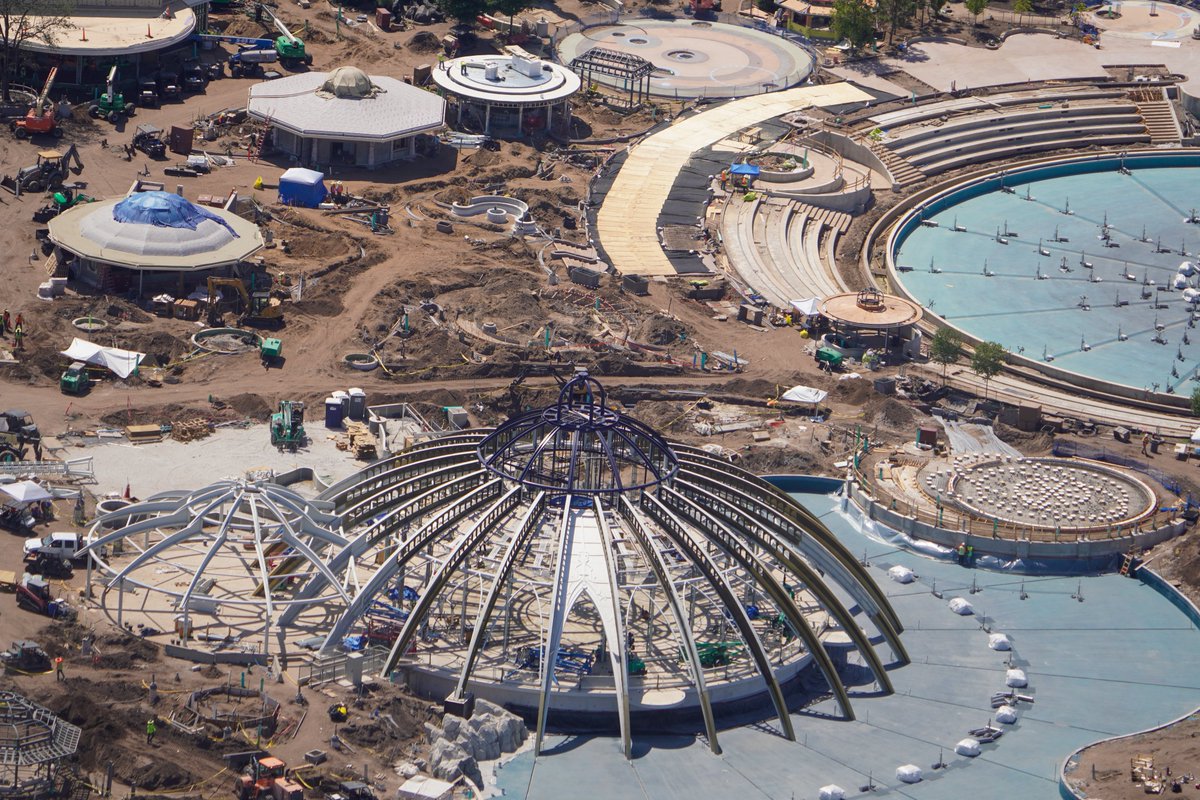 Aerial photo of Celestial Carousel and a series of food and beverage locations near the Epic Universe show fountain.
