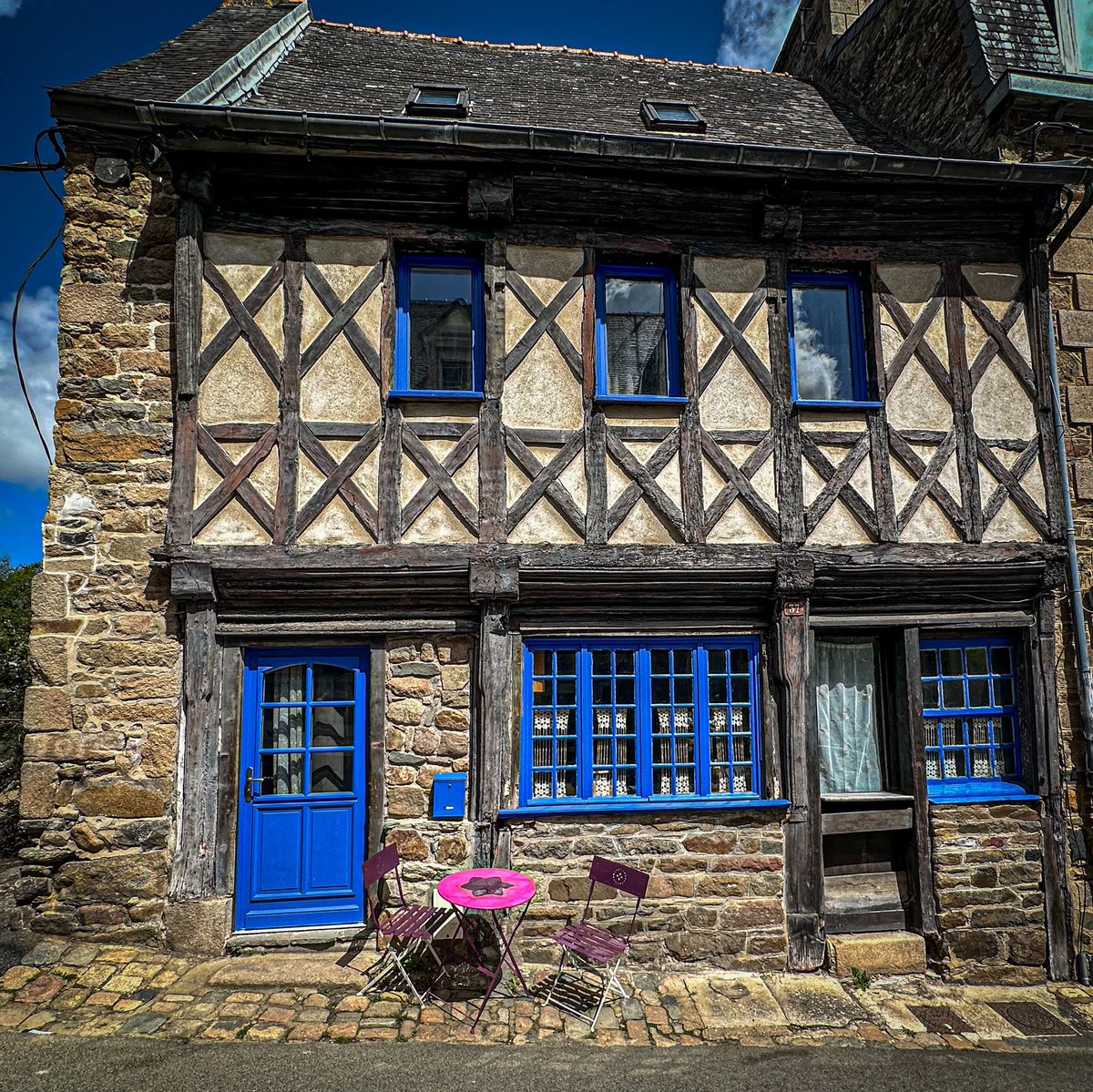 Distinctive Breton Blue and salient mauve chairs and table: Tréguier , Côtes-d’Armor #Bretagne #DailyDoor
