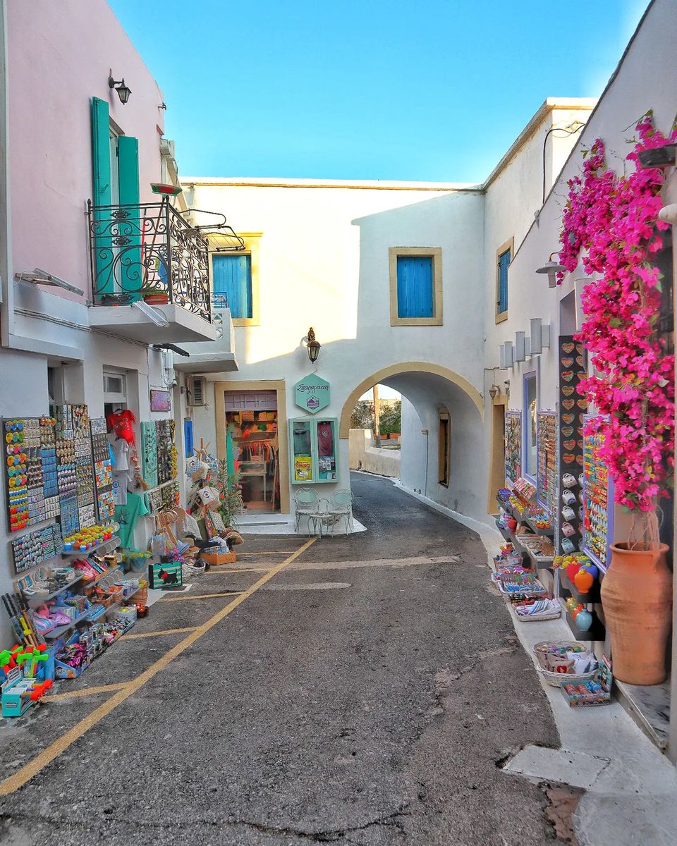 The kaleidoscope of colors on this charming street in #Kythira captures the vibrant spirit of the island, where even the shadows are painted with light. 📷 tasos_paisios