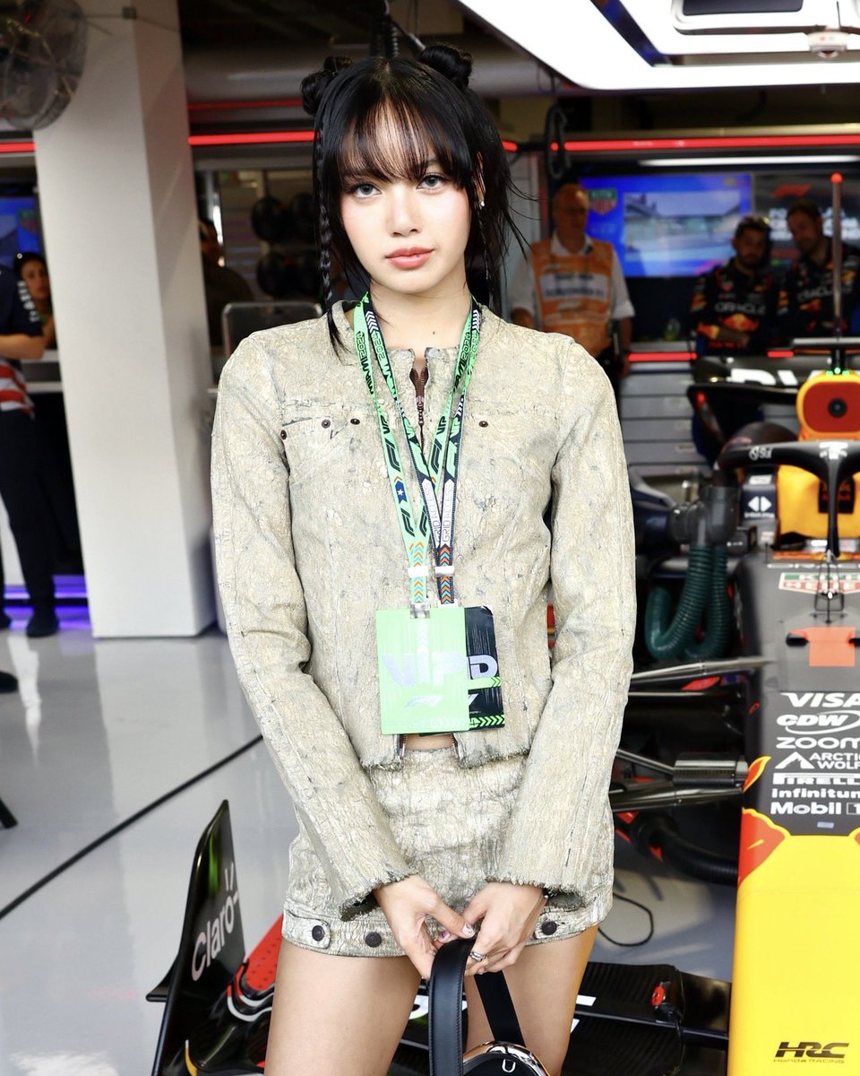 Lisa wears SS24 runway denim jacket and skirt at the F1 Grand Prix in Miami.