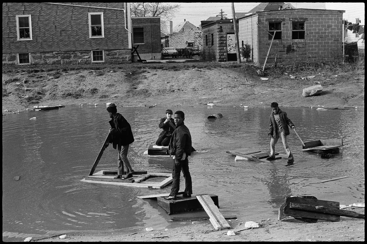 The big picture: #HuckFinn in 1970s New Jersey. Pioneering Black photographer #MingSmith captures four boys creating rafts from rubbish in New Jersey @NicolaVassell theguardian.com/artanddesign/a… #photography