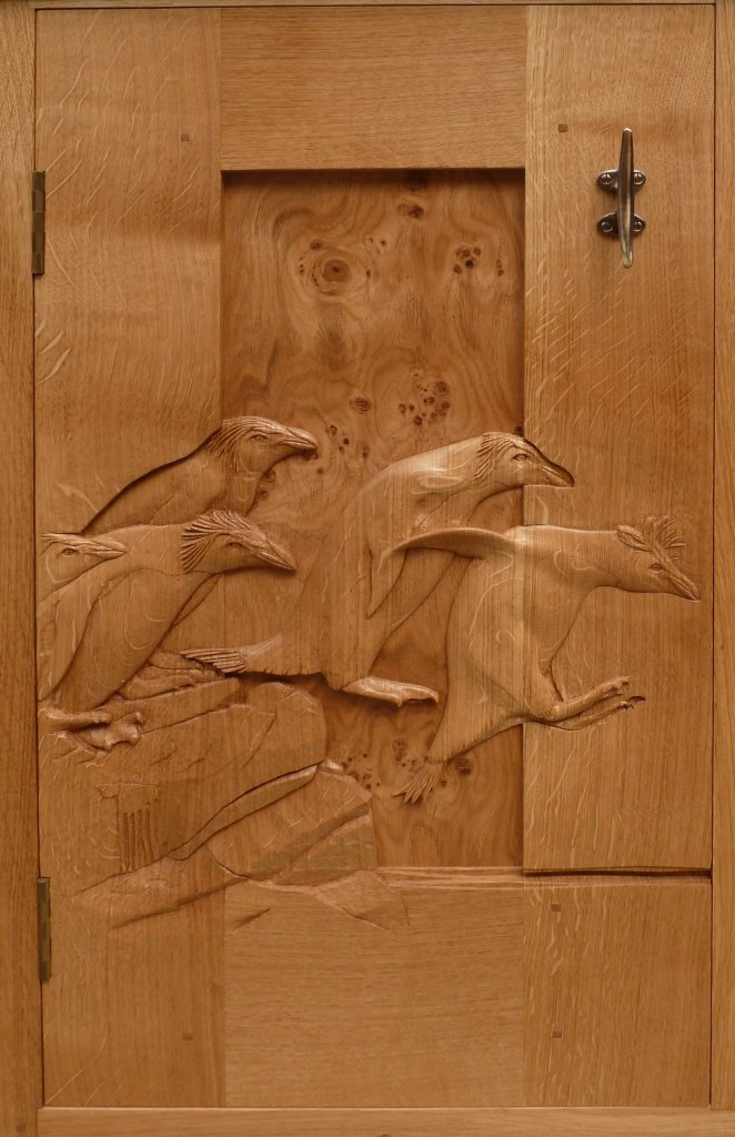 Another beautiful hot and sunny day in Scotland. Perfect penguin weather!

Solid oak cabinet door detail (with brass marine cleat handle) from the old man's archive.

#mastercarver #woodcarving #woodwork #handmade #penguins