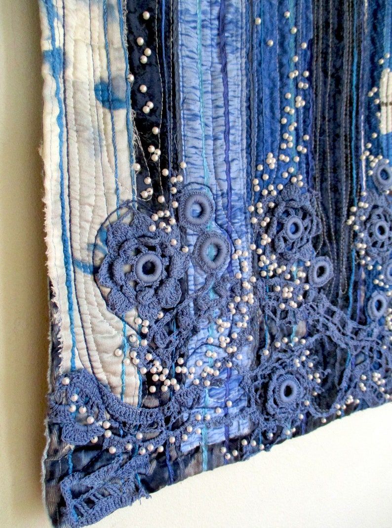 Discover a stunning textile masterpiece - Blue Waterfall Wall Art measuring 13.5 X 37 inches. Elevate your space with this unique piece. #TextileArt #WallDecor buff.ly/3w6ApP9
