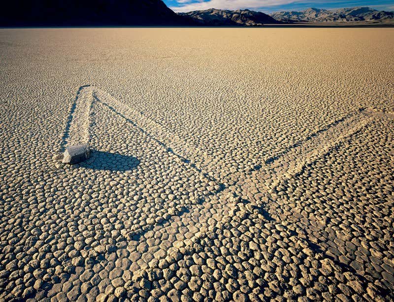 The Sailing Stones of Death Valley, located in Racetrack Playa, California, are a captivating natural phenomenon. Weighing up to several hundred pounds, these stones mysteriously glide across the desert landscape without human or animal intervention.