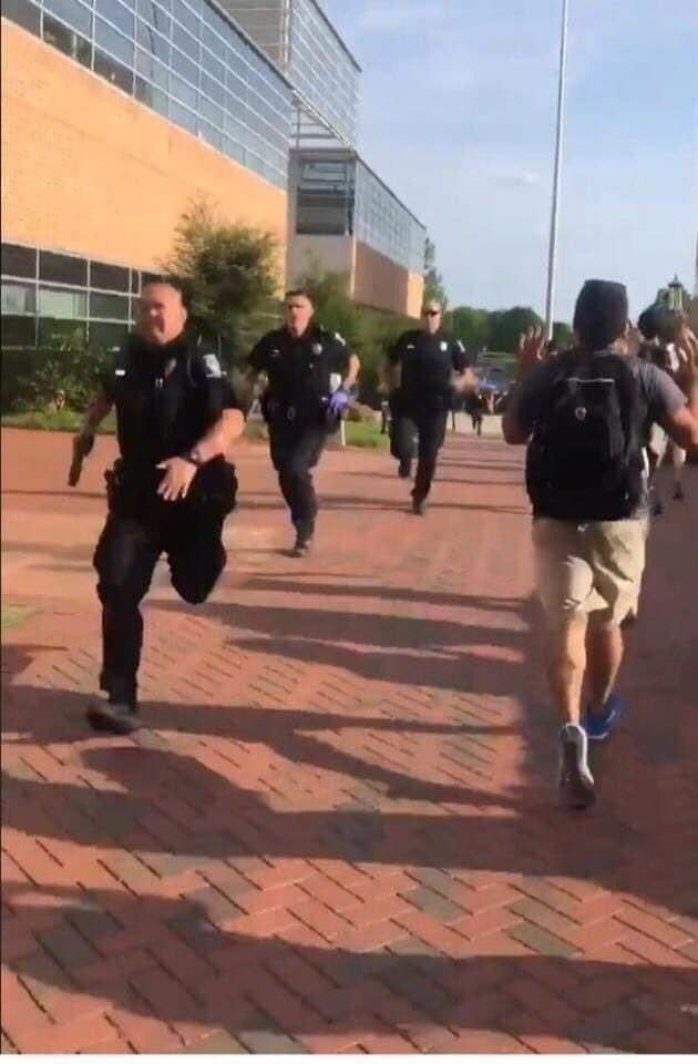 This photo was taken in 2019 as an active shooter killed two and injured several more at a campus in North Carolina.

On the right are the students fleeing the gunfire.

On the left are police running toward it.

Let that sink in.