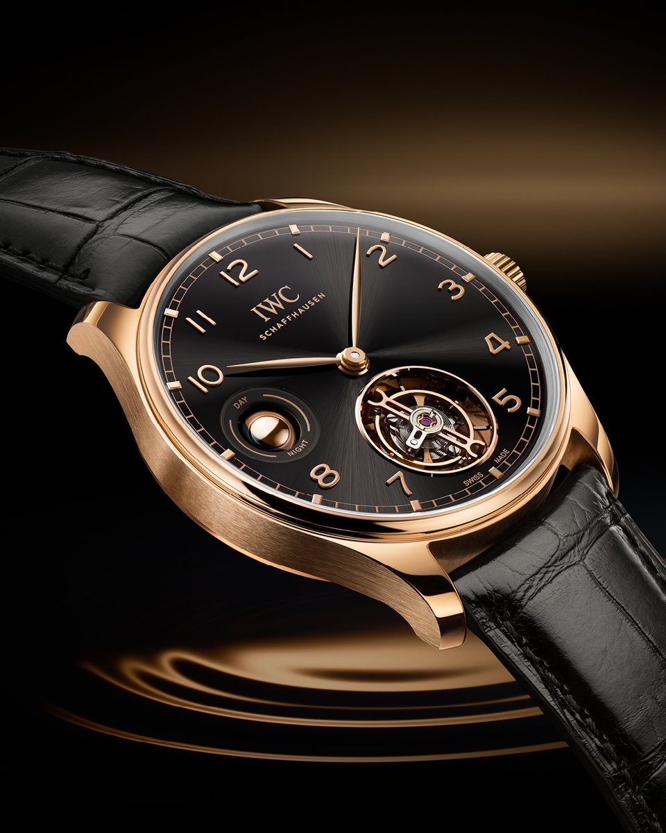 The Portugieser Hand-Wound Tourbillon Day & Night in 18-carat Armor Gold® with an Obsidian dial, gold-plated hands, gold appliques, and black alligator leather strap. Explore the Portugieser range here: ow.ly/UqBe50RzeEn #CWSellors #JuraWatches #ProudlyMadeInSchaffhausen