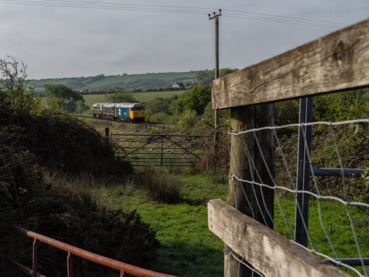 The early morning loco move from Swanage to Corfe Castle see 50021 D5054 & D6515 passing Crofe Common 10/05/34