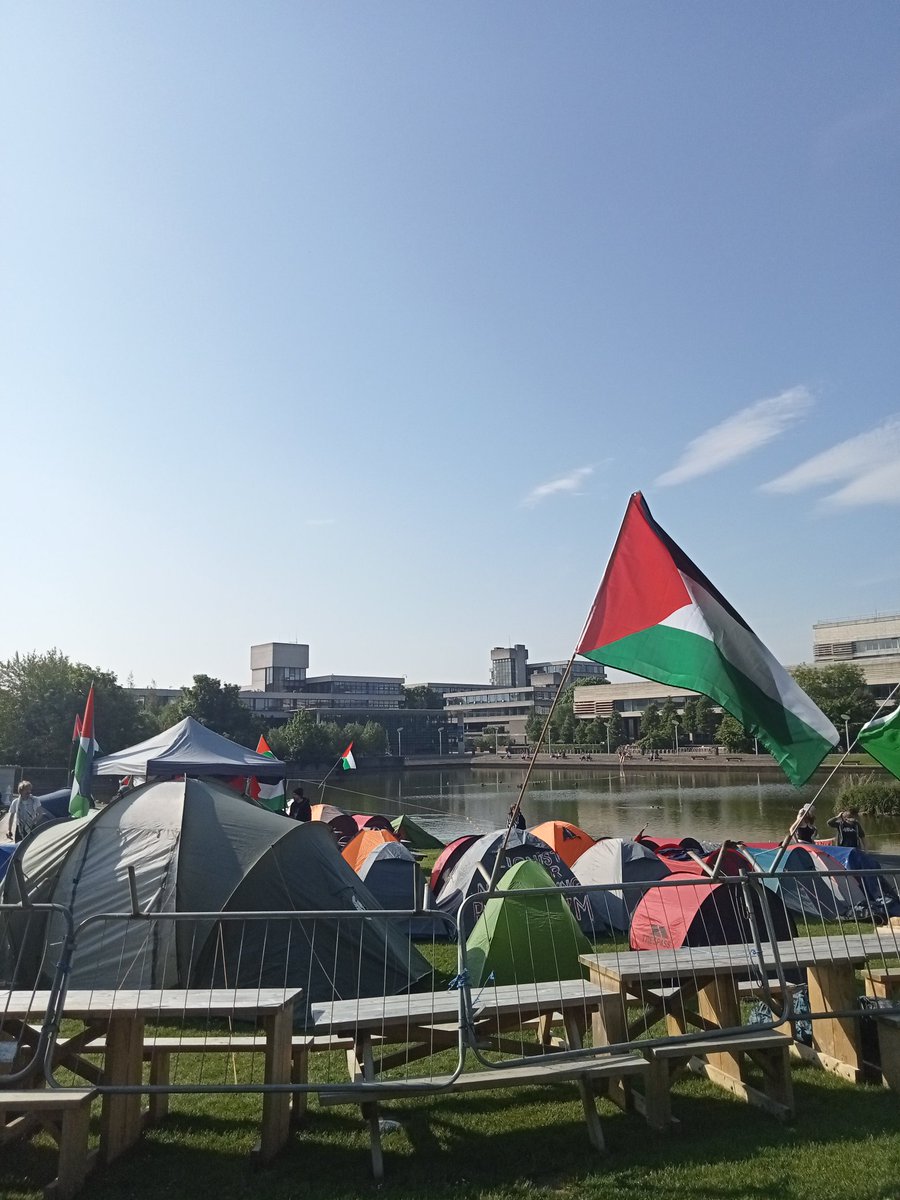 Day 2 at UCD Liberation Camp, @UCDEstates have removed our Palestine flags and banners from the UCD sign. Join us by the lake at 9pm tonight for a gig for Gaza with local musicians and poets.