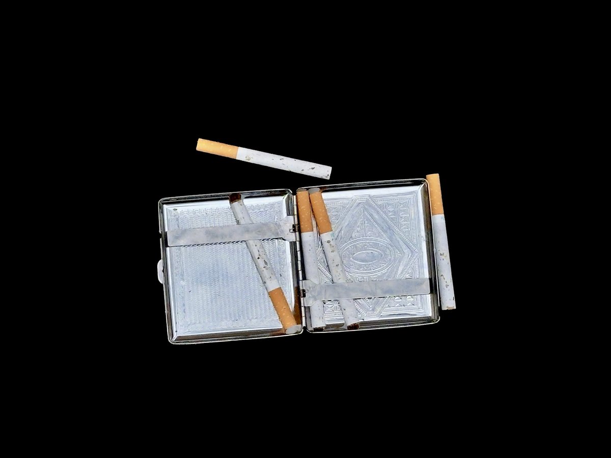 “A cigarette is a pinch of tobacco rolled in paper with fire at one end and a fool at the other.' (George Bernard Shaw)

#VintageCharm #SmokersLife #TobaccoArt #RetroStyle #CigaretteCase #OldSchoolCool #ClassicVibes #NostalgicMoments #CollectorItems #TimeCapsule #VintageAesthetic