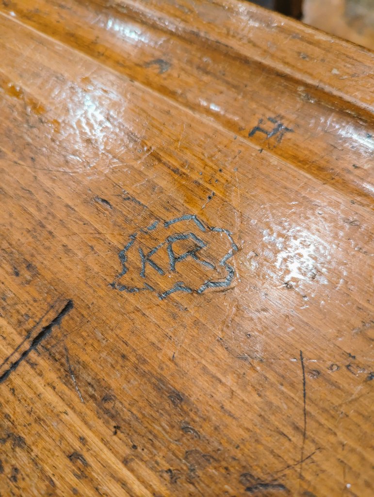 So I bought two matching vintage school desks, which have various things carved into them... But yesterday we realized right on the top of one is the initials KR 🤯