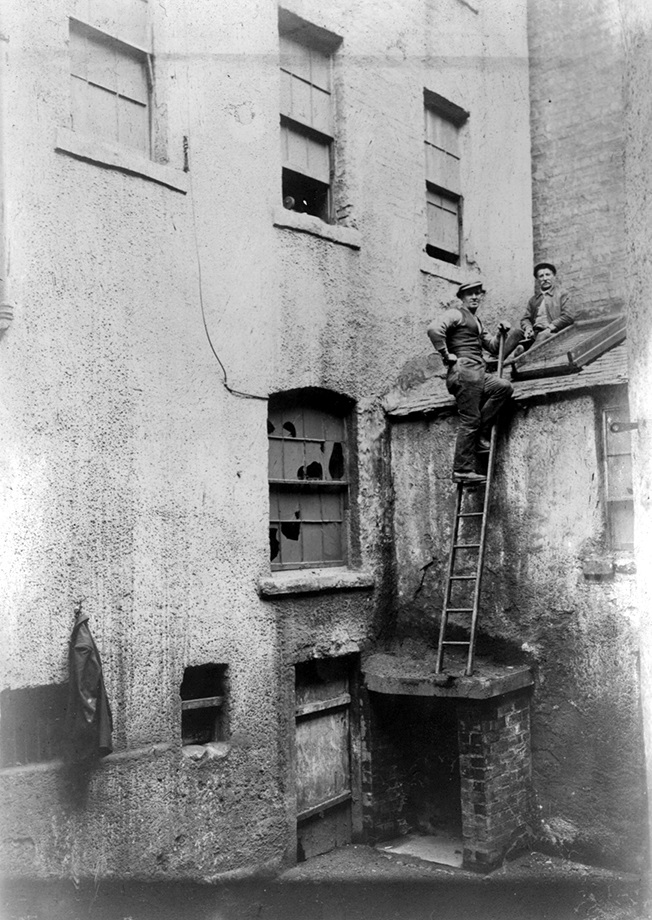 North Frederick St, slum housing, showing two workmen, c.1918 Archive Ref: D-HE 8/3, p.04