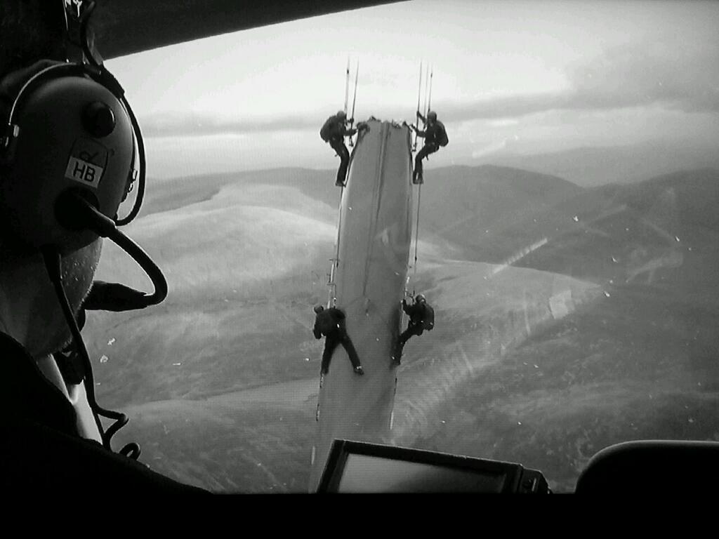 Christopher Nolan directing the aerial stunt work for The Dark Knight Rises from a helicopter.