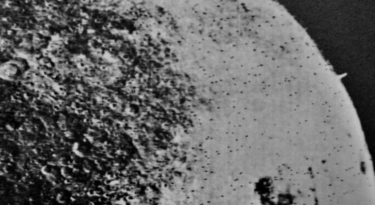 This photograph of The Moon from the Soviet Zond-3 space probe seems to show a tower-like structure protruding from the Lunar surface (TOP-RIGHT) Thoughts?