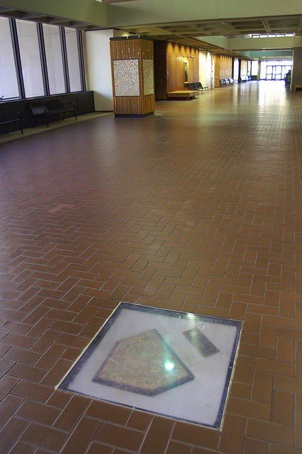 Home plate from Forbes Field remains embedded in the lobby floor of the University of Pittsburgh's Posvar Hall near its original spot.