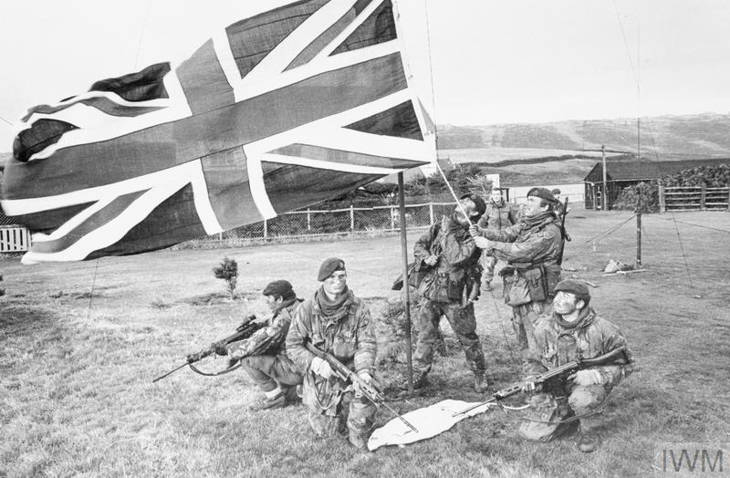 The Falklands War. Marines of 40 Royal Marine Commando raised the British flag on West Falkland after the Argentine surrender, 1982. Source: IWM (FKD 435)