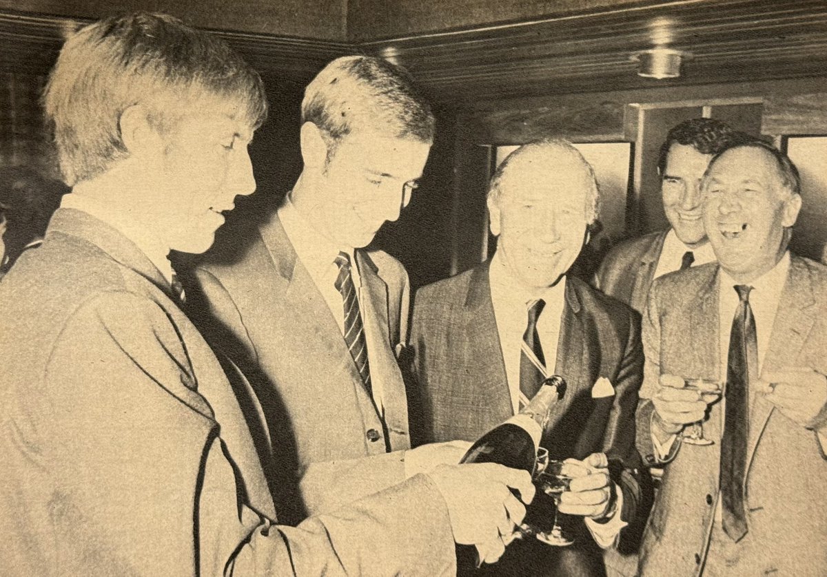 Colin Bell and Colin Waldron serve drinks to Matt Busby, Malcolm Allison and Joe Mercer at the opening of their restaurant