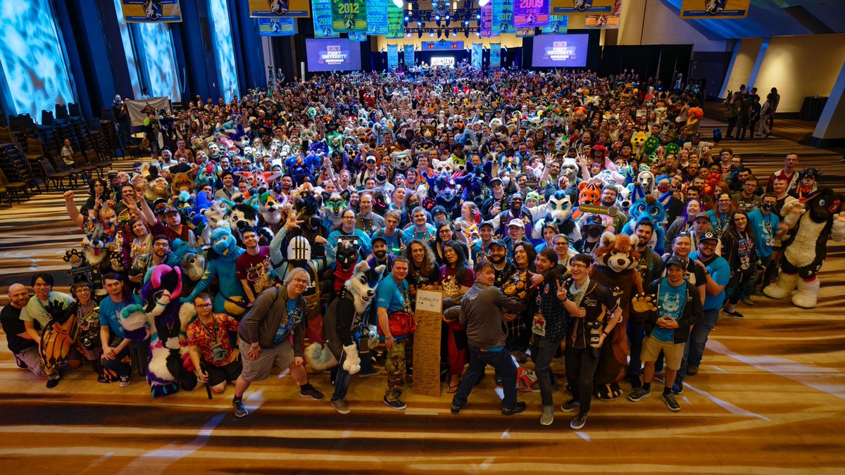 The VR furry community came together in a huge way @FurryWeekend this year! Thank you so much to everyone who came to the #FWA2024 #VRChat Meetup! Can you spot yourself? Zoom in and let us know where you are in the replies! 📸: @Nixtorm_ Photo download link below 👇